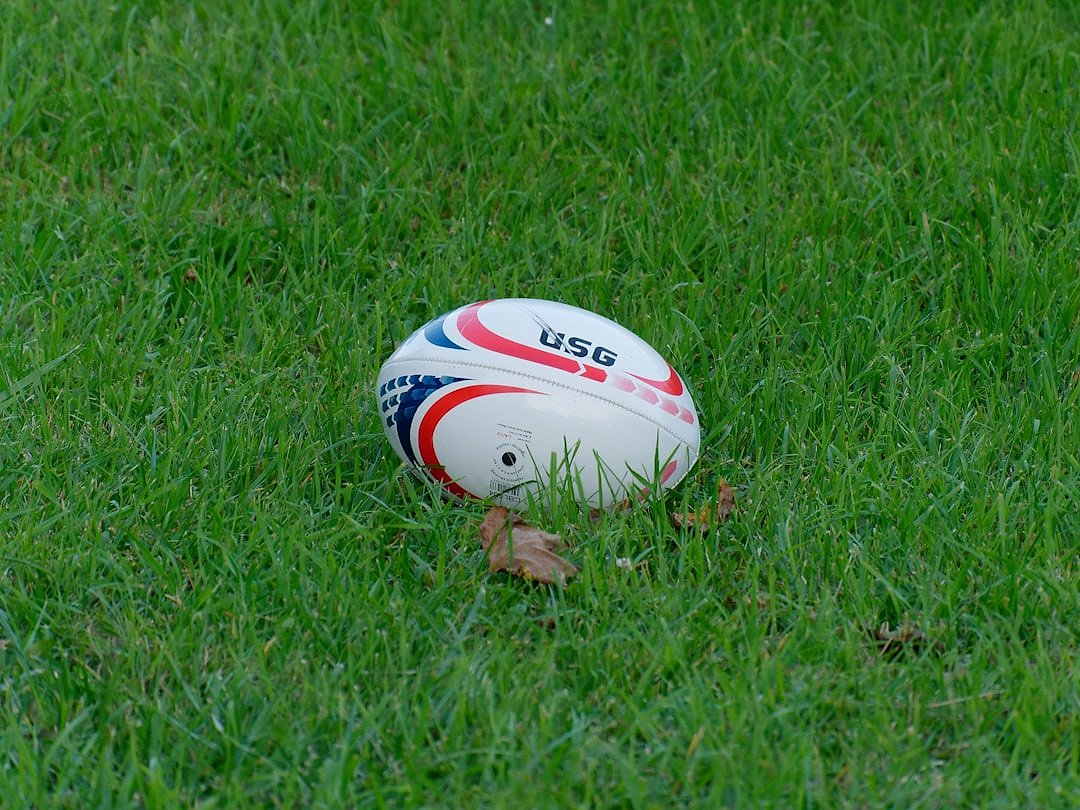 A rugby ball on a green pitch, evoking the decisive moments of a test match