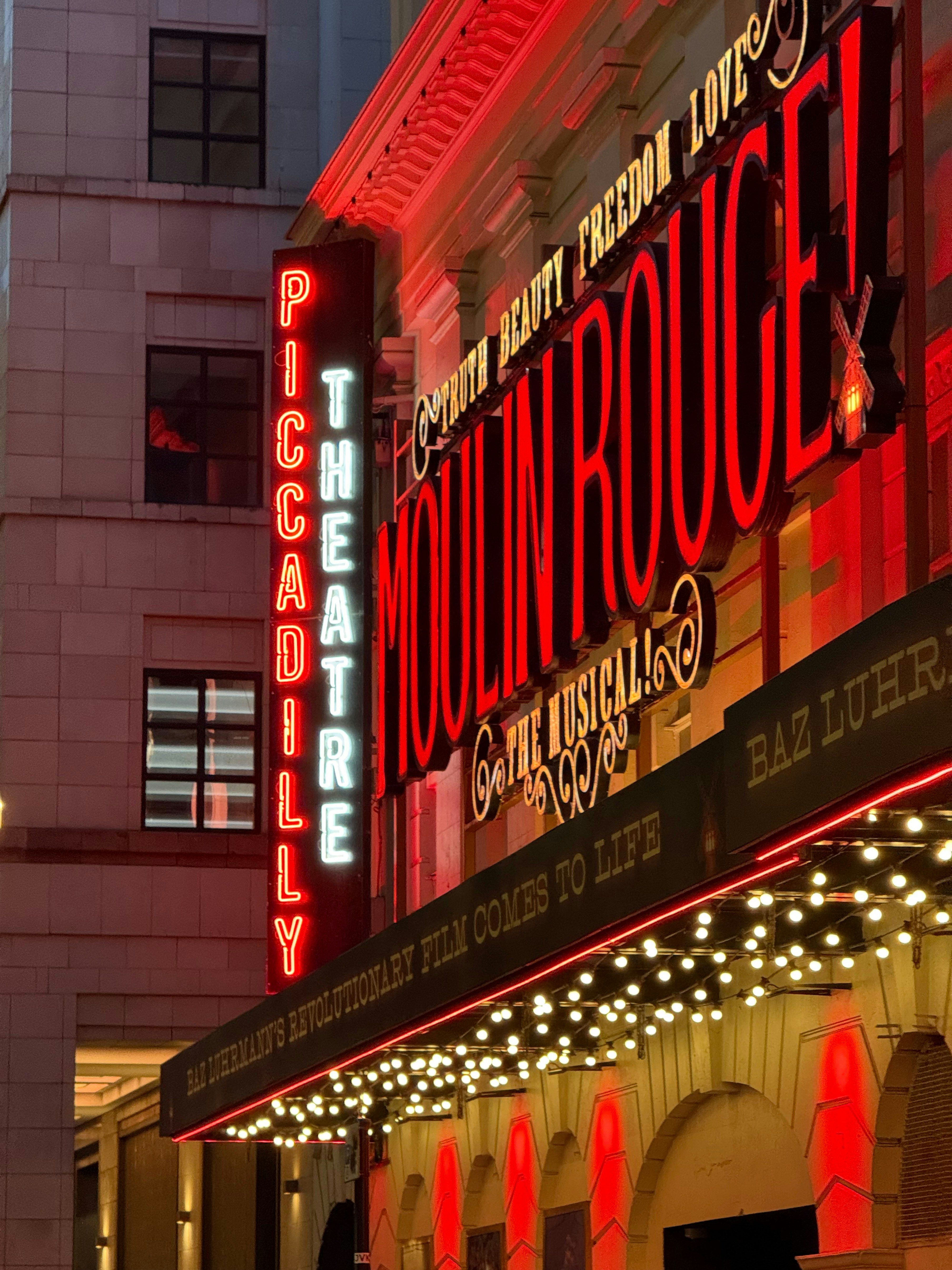 Theatre marquee illuminated at night