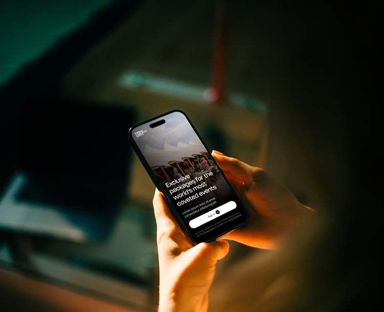 Hand holding a phone with the Imperial app