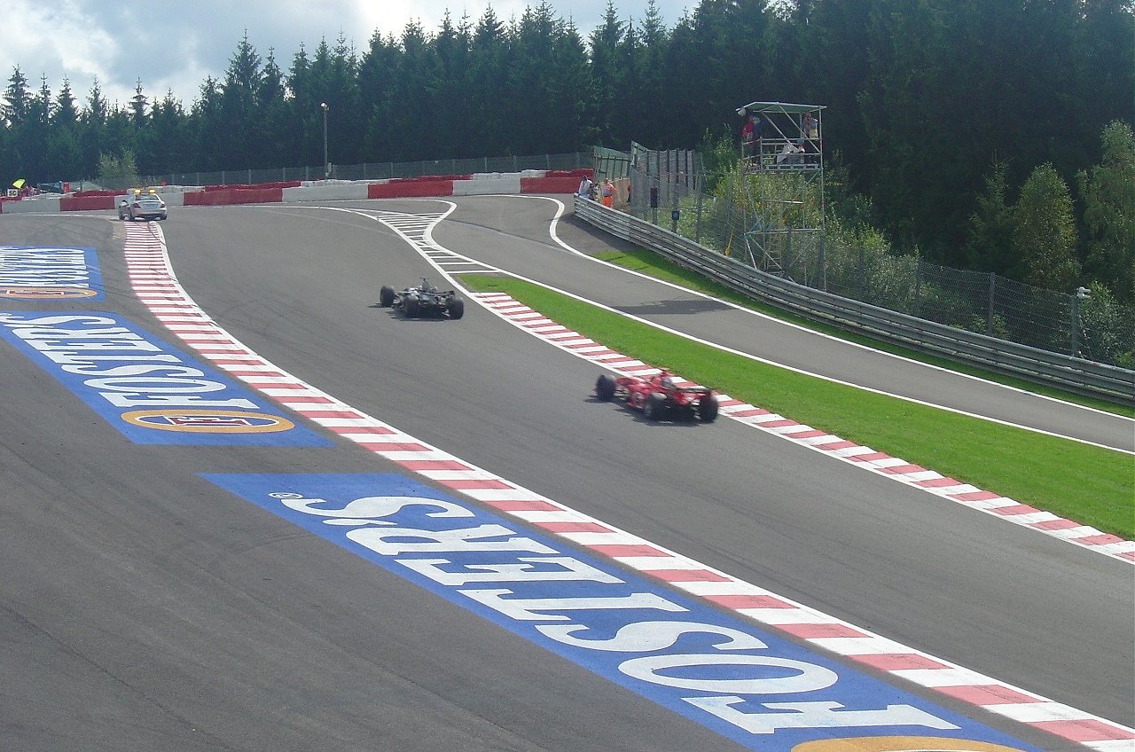 Ferrari Formula 1 car racing on circuit, representing the mid-2000s era of the Belgian Grand Prix