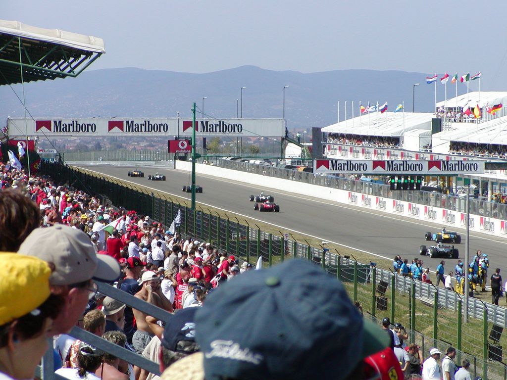 Fans watching from grandstands at a Formula 1 circuit