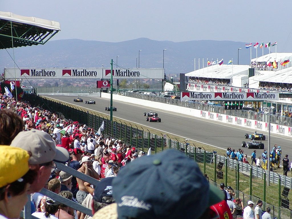Fans watching from grandstands at a Formula 1 circuit