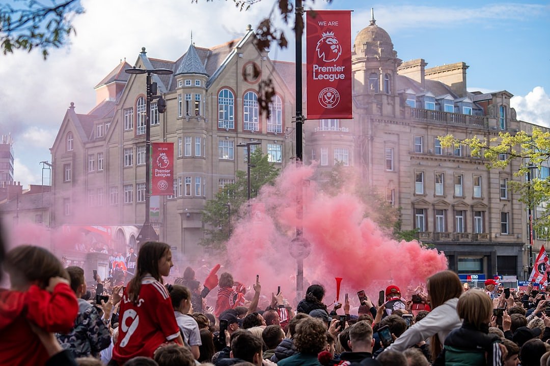 Football fans celebrating with flares and atmosphere