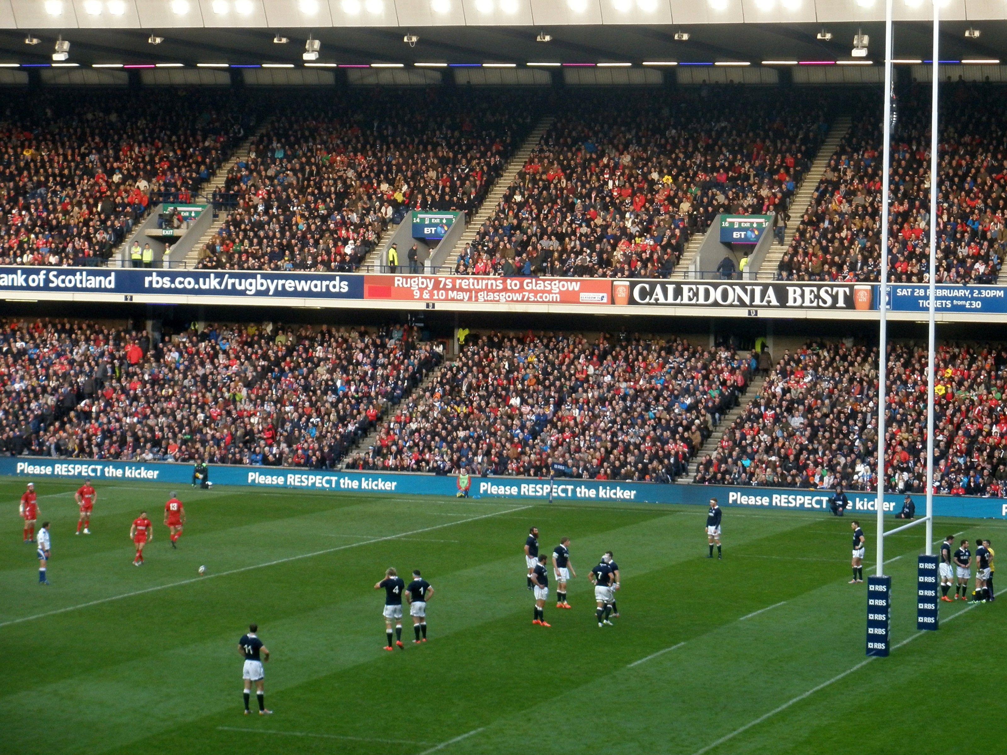 Murrayfield during Scotland v Wales in the 2015 Six Nations, with Please Respect the Kicker boards along the stand