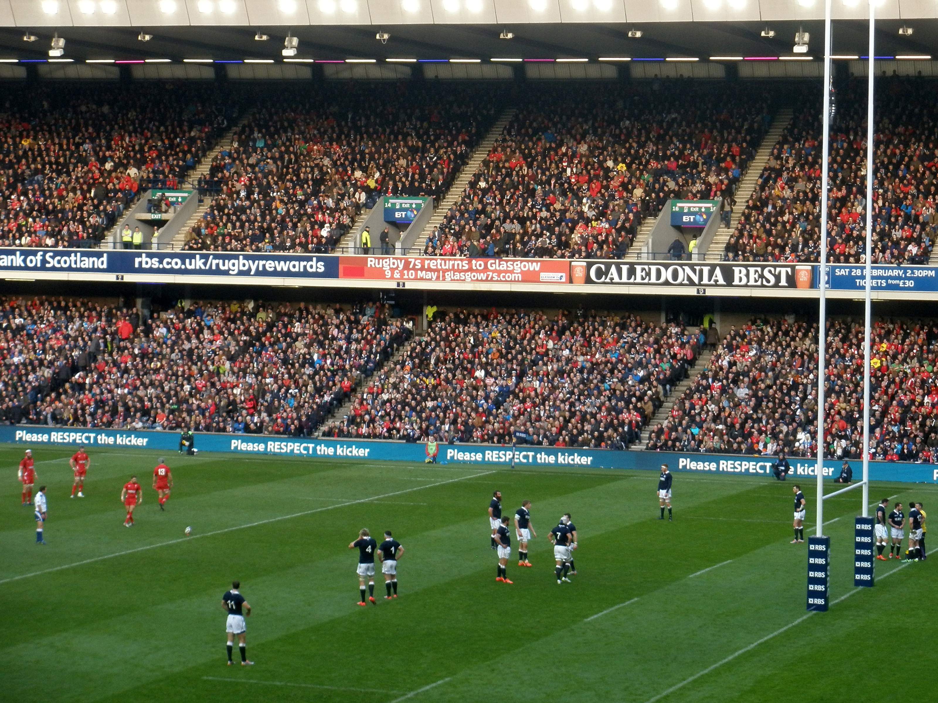 Murrayfield during Scotland v Wales in the 2015 Six Nations, with Please Respect the Kicker boards along the stand