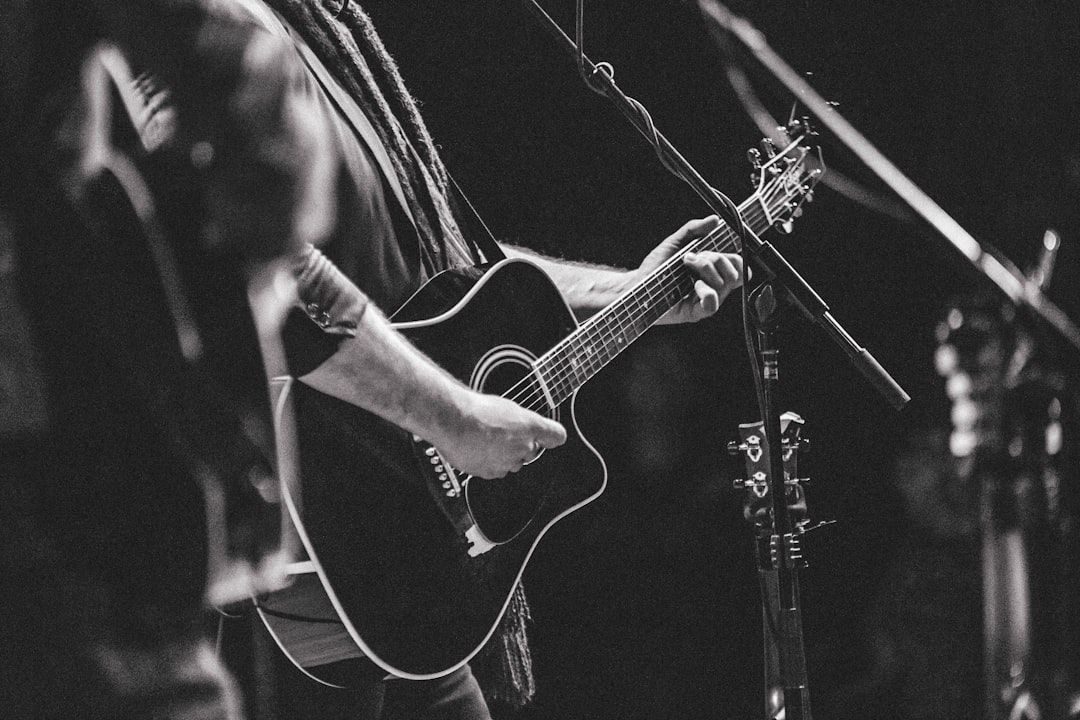 Intimate acoustic guitar performance, reflecting the stripped-back style of Clapton's Unplugged era