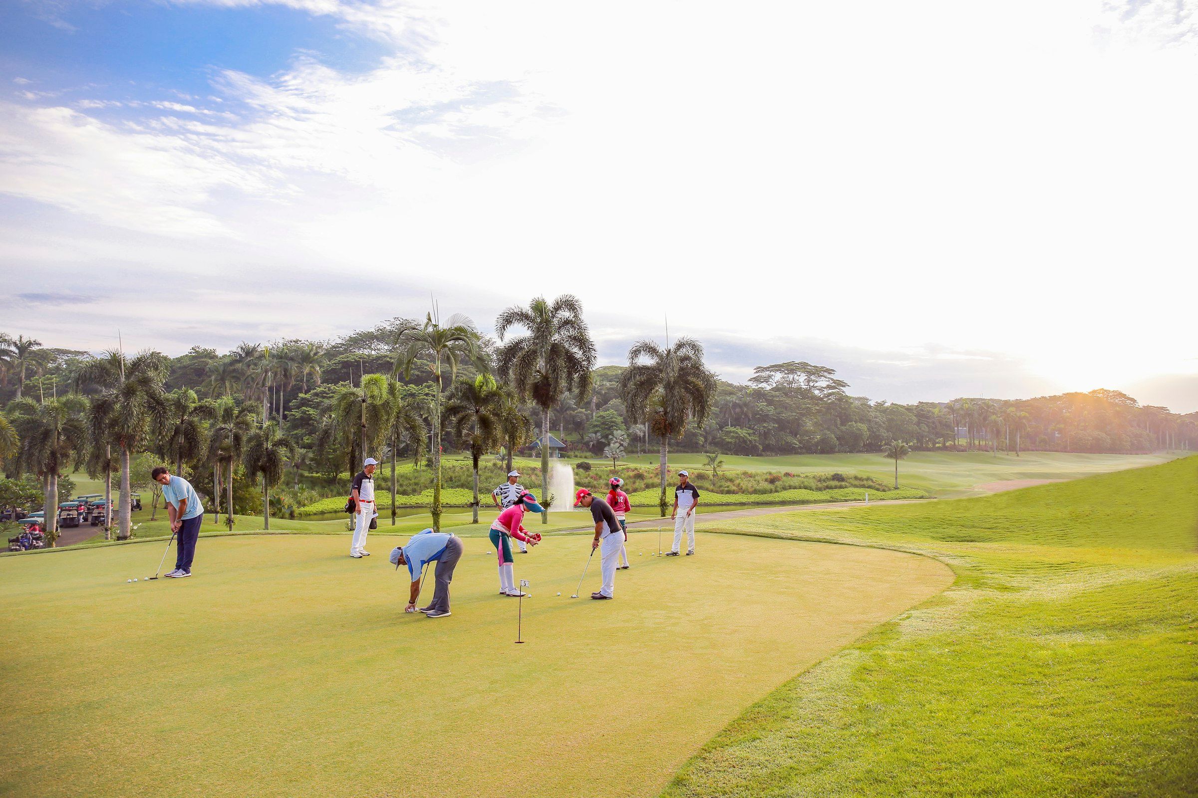 Ryder Cup-style golf scene (people playing golf during daytime)