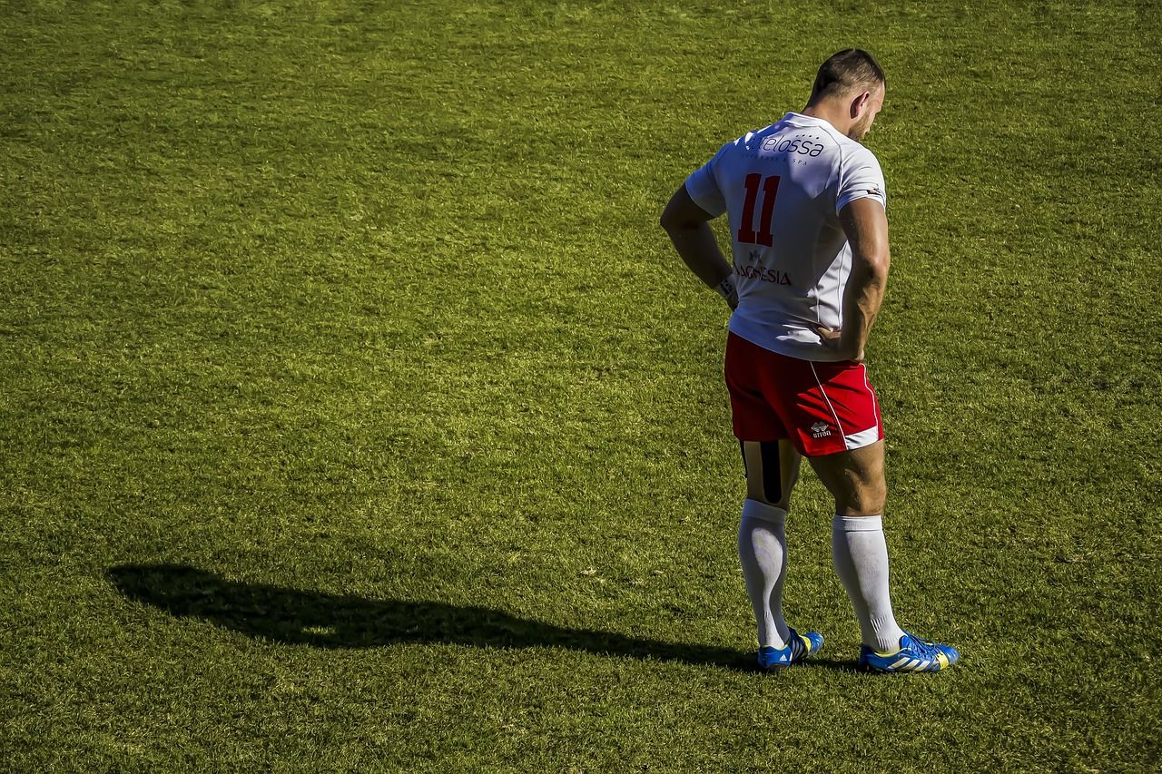 Rugby player on the pitch in a stadium setting
