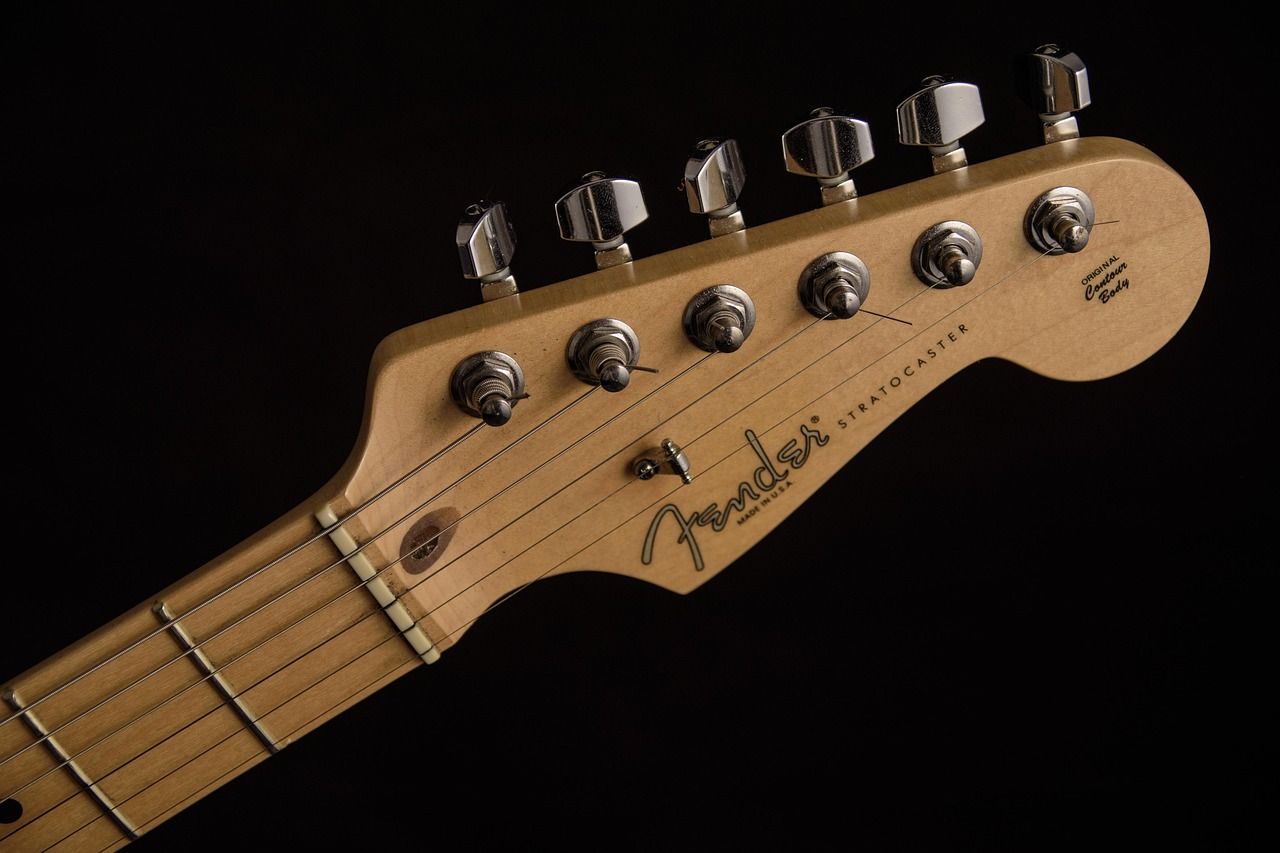Close-up of a Fender Stratocaster headstock, the guitar synonymous with Jeff Beck