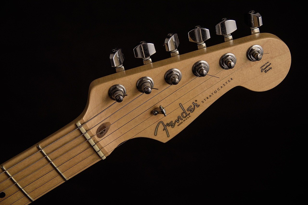 Close-up of a Fender Stratocaster headstock, the guitar synonymous with Jeff Beck