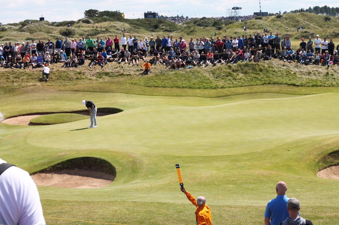 Spectators following play at The Open Championship on a links course