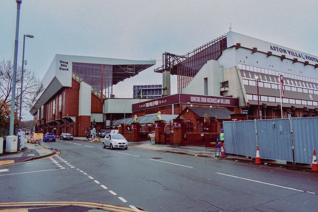 Villa Park exterior on a matchday with supporters approaching the ground