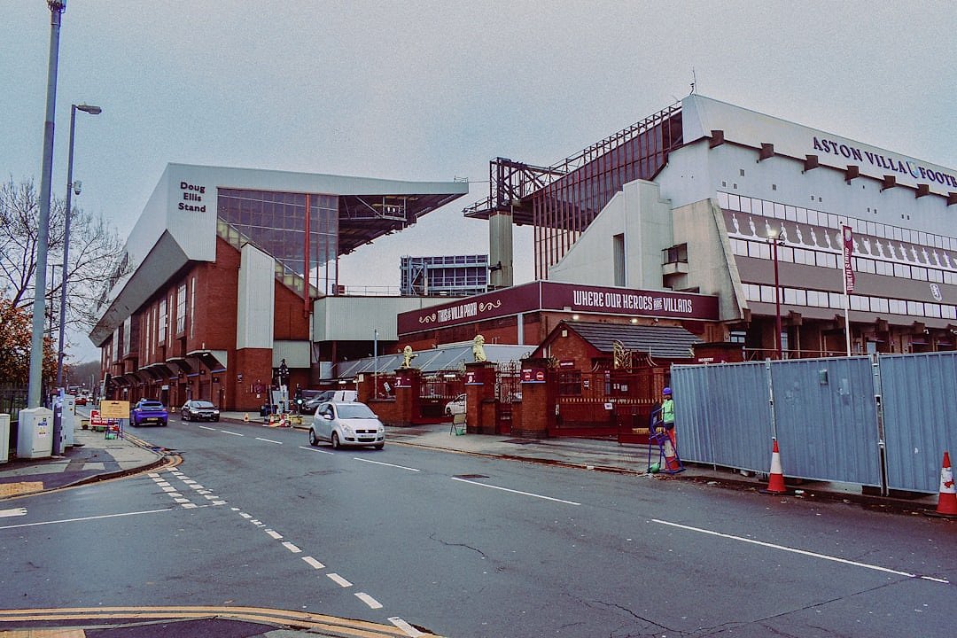 Villa Park exterior on a matchday with supporters approaching the ground