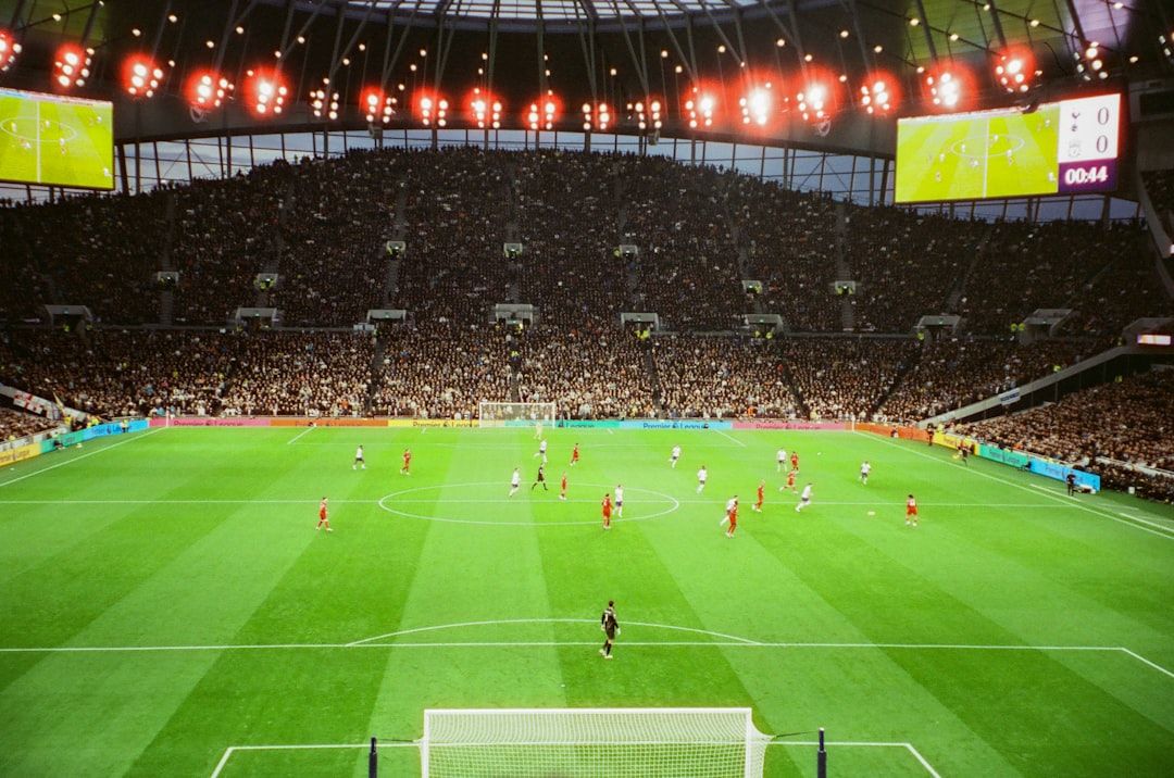 Tottenham Hotspur Stadium interior on matchday with fans filling the stands