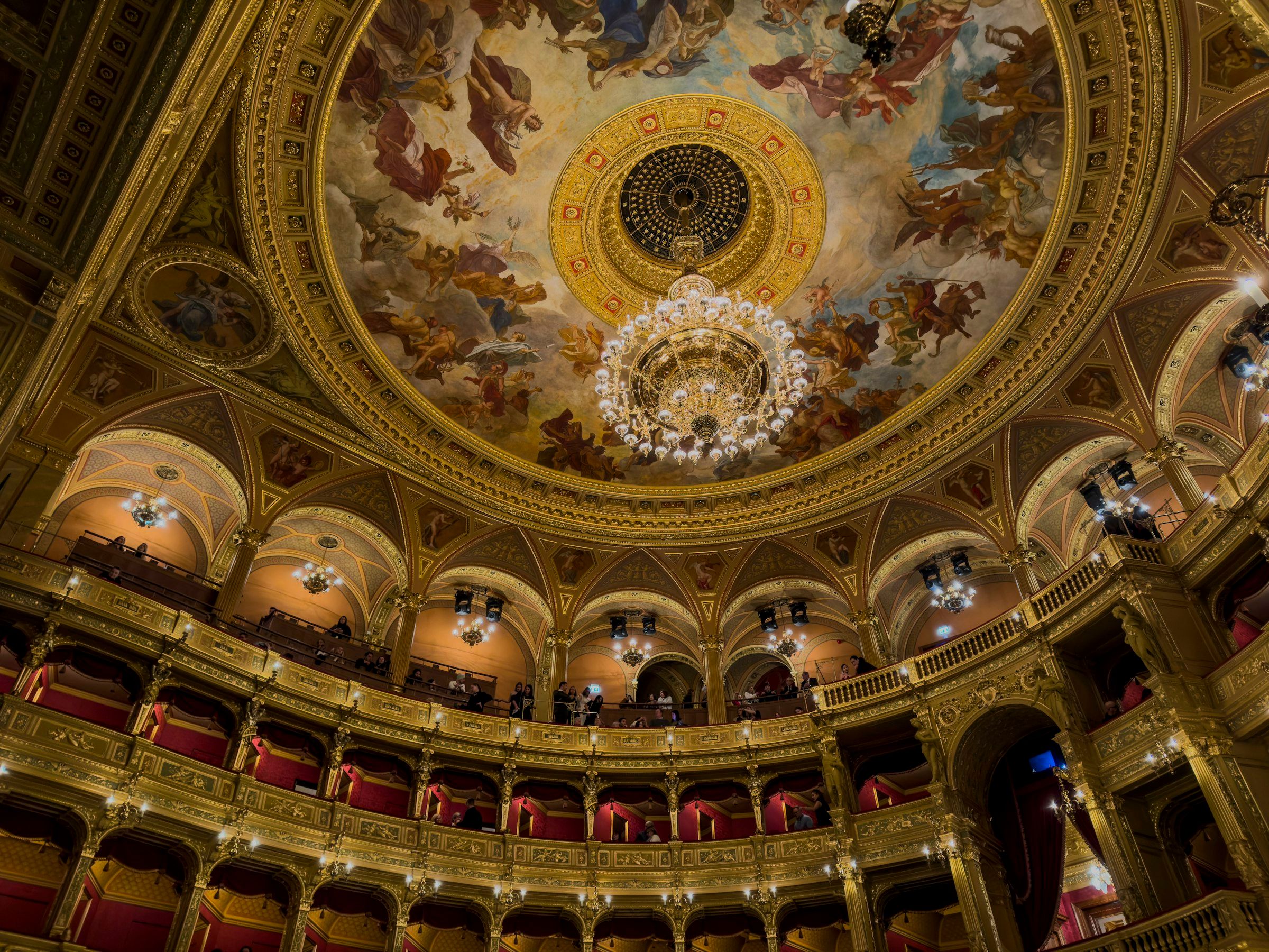The Royal Opera House at Covent Garden (Ornate opera house interior with gilded details and ceiling frescoes)