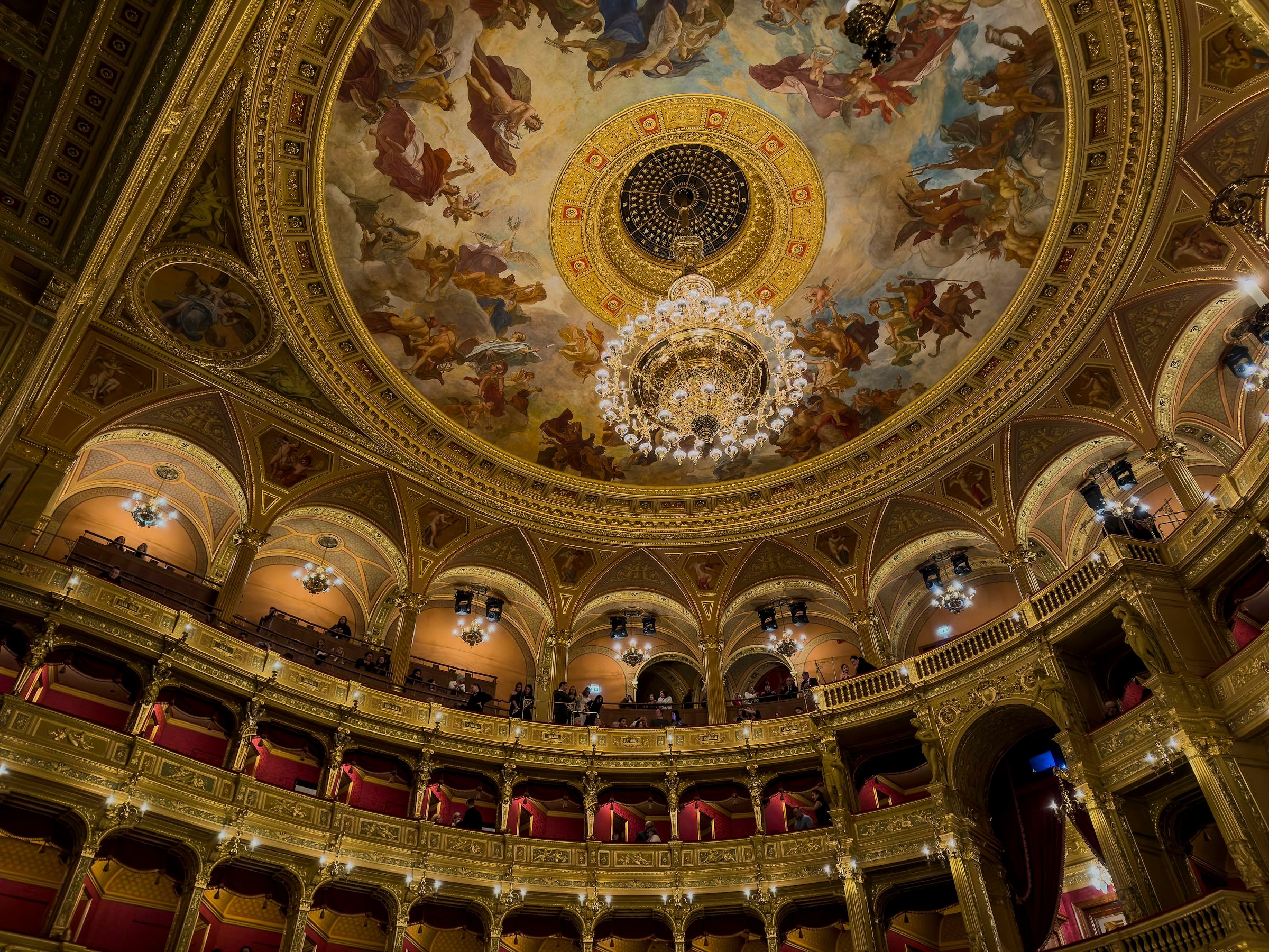 The Royal Opera House at Covent Garden (Ornate opera house interior with gilded details and ceiling frescoes)