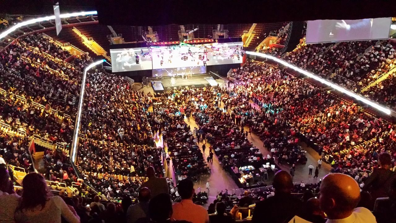 Stadium arena filled with a massive concert crowd