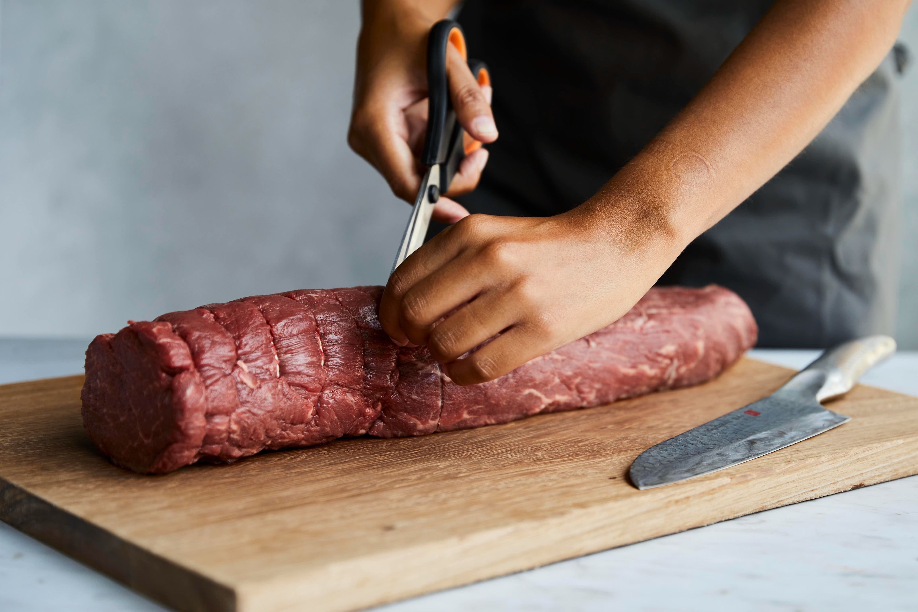 Participants at a Beef Wellington cooking class at the Gordon Ramsay Academy
