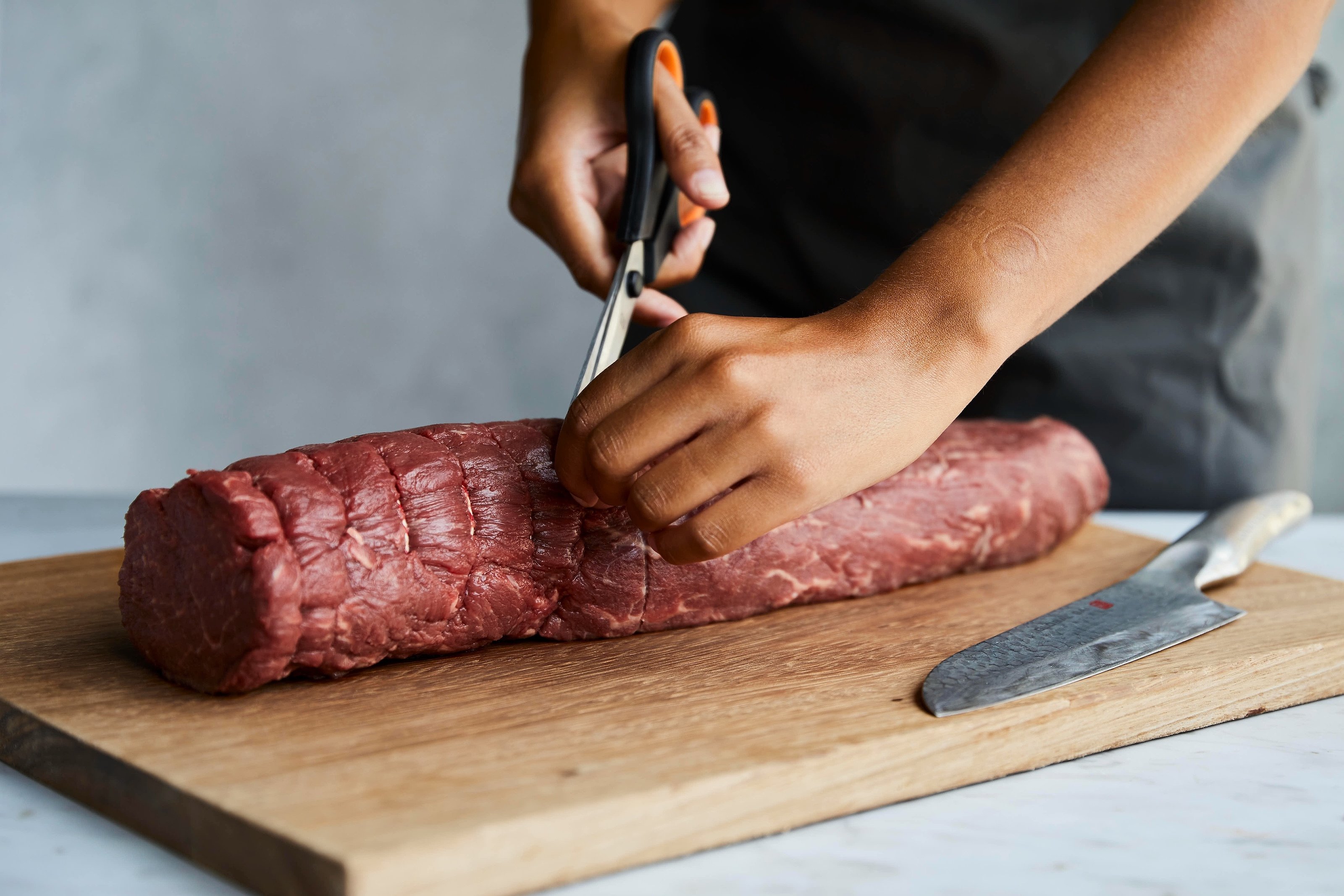 Participants at a Beef Wellington cooking class at the Gordon Ramsay Academy
