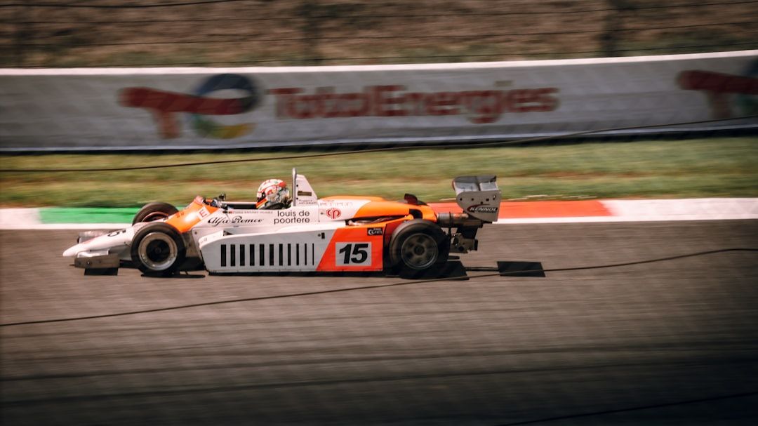 Vintage racing driver in the cockpit of a classic grand prix car
