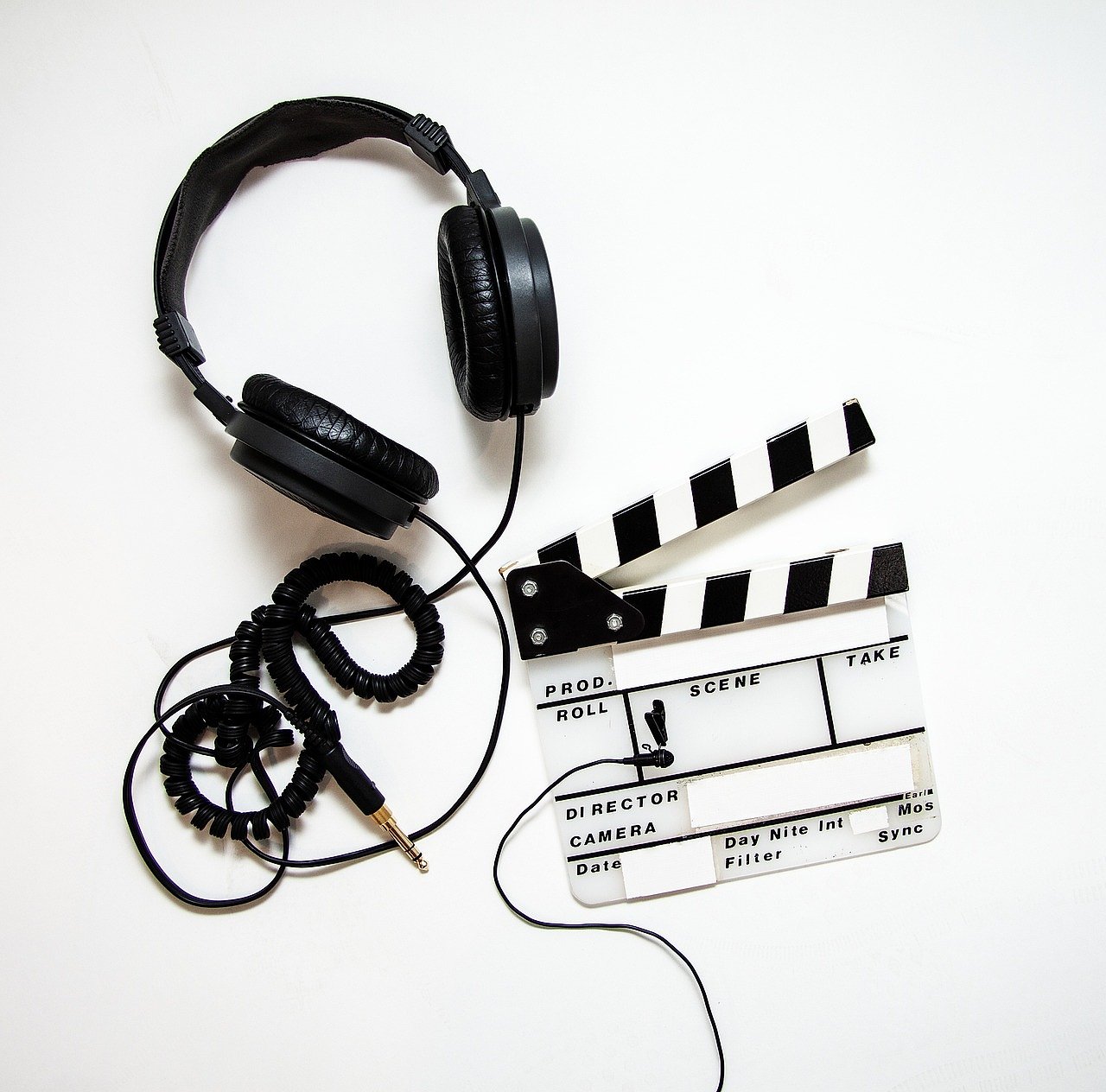 Film clapperboard and headphones representing the I Am: Celine Dion documentary