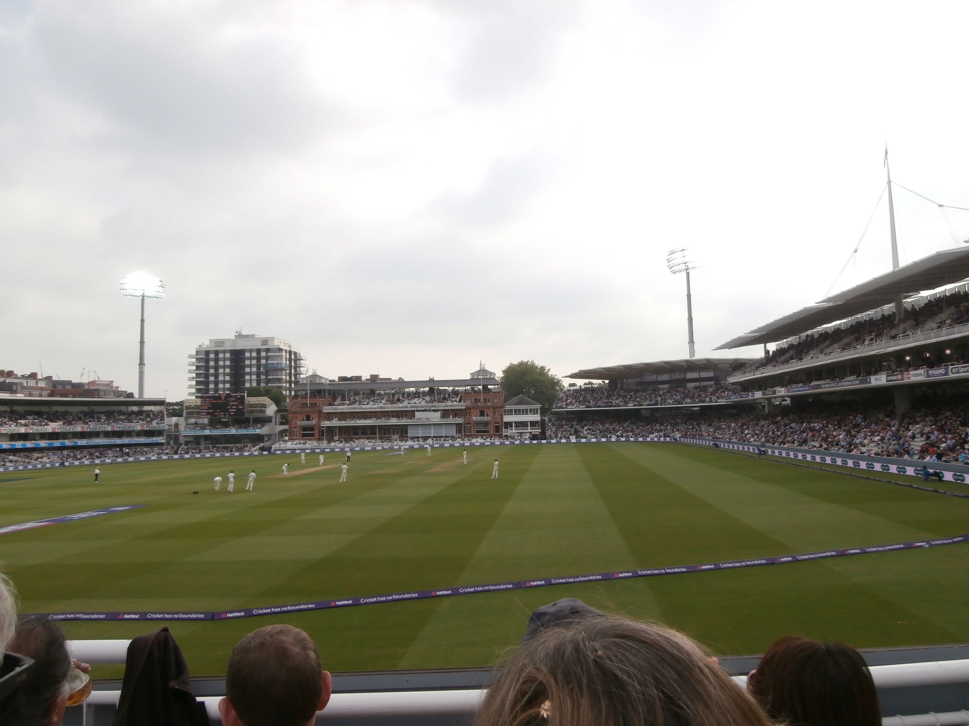 Lord's Cricket Ground on a full day's play, the Victorian Pavilion across the ground