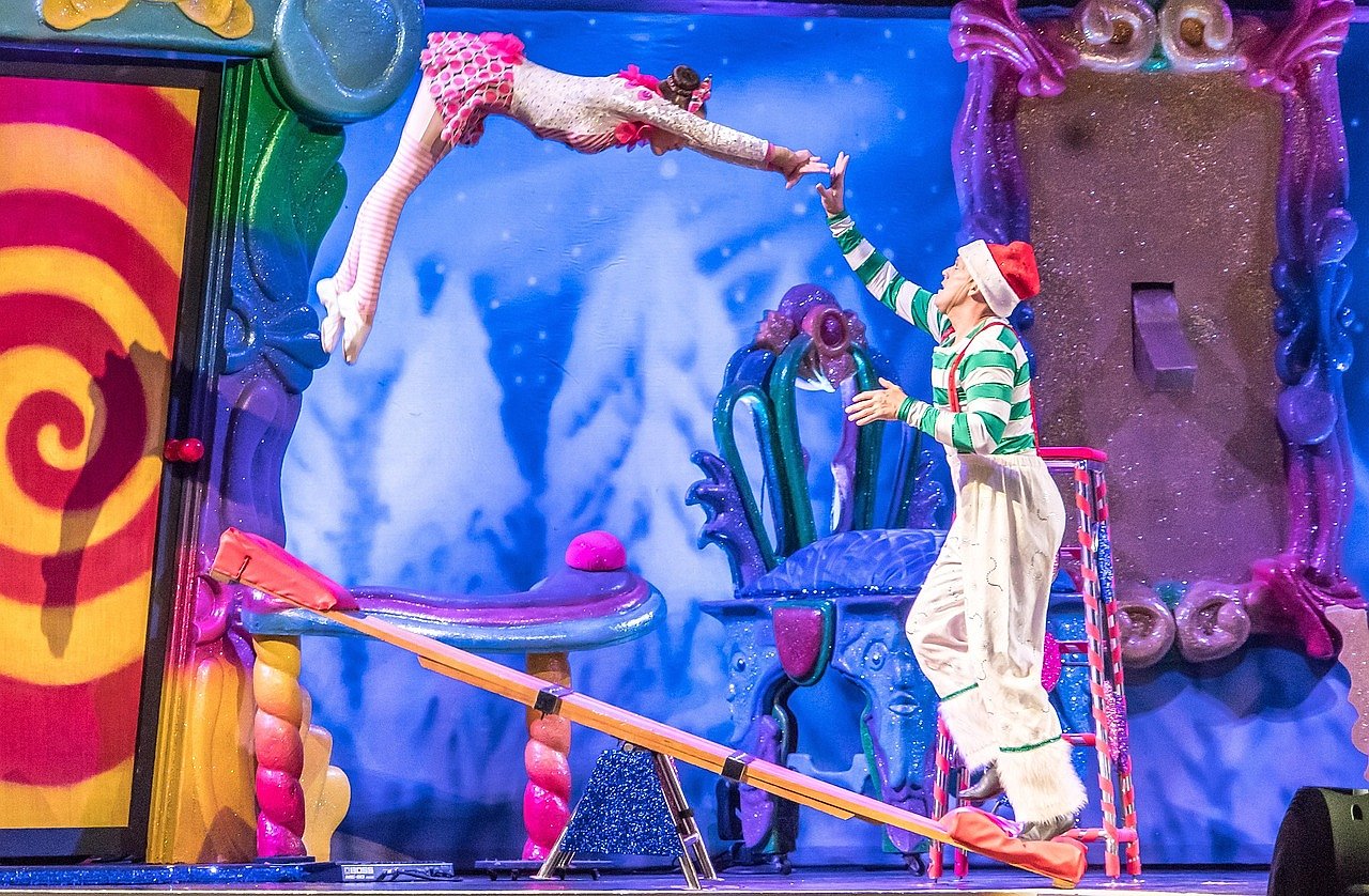 Cirque du Soleil acrobats performing in a dramatic stage production