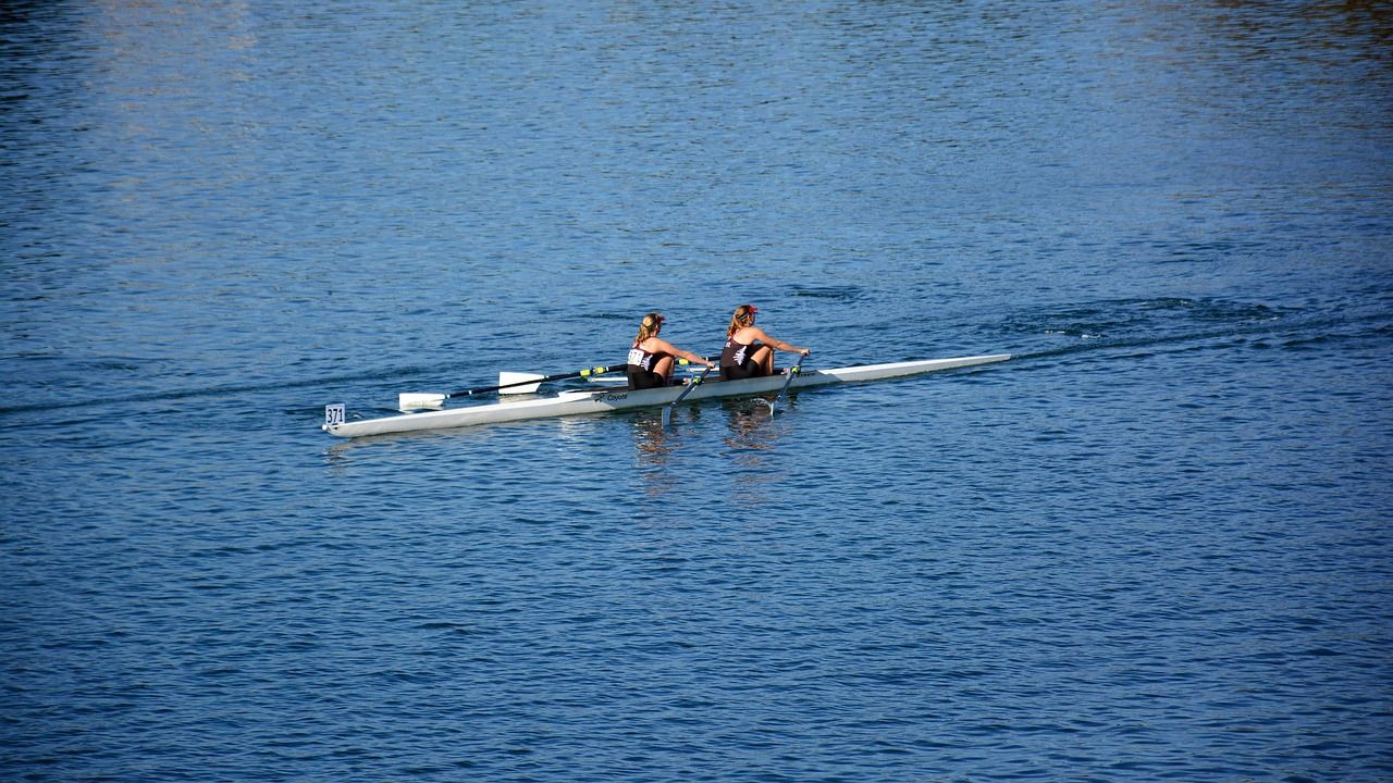 Rowing quad racing on a straight course, reflecting the format adopted at Henley in 1924