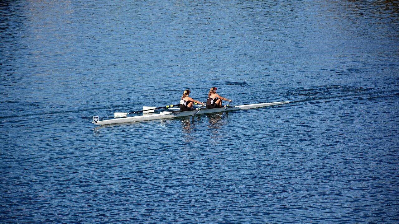 Rowing quad racing on a straight course, reflecting the format adopted at Henley in 1924