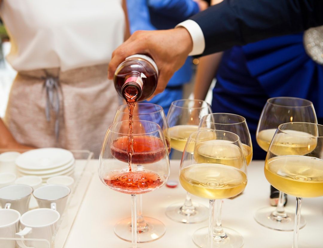 Wine being poured at an elegant tasting event