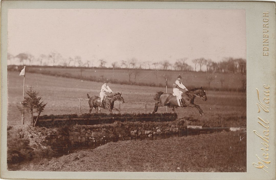 Vintage horse racing with two jockeys competing