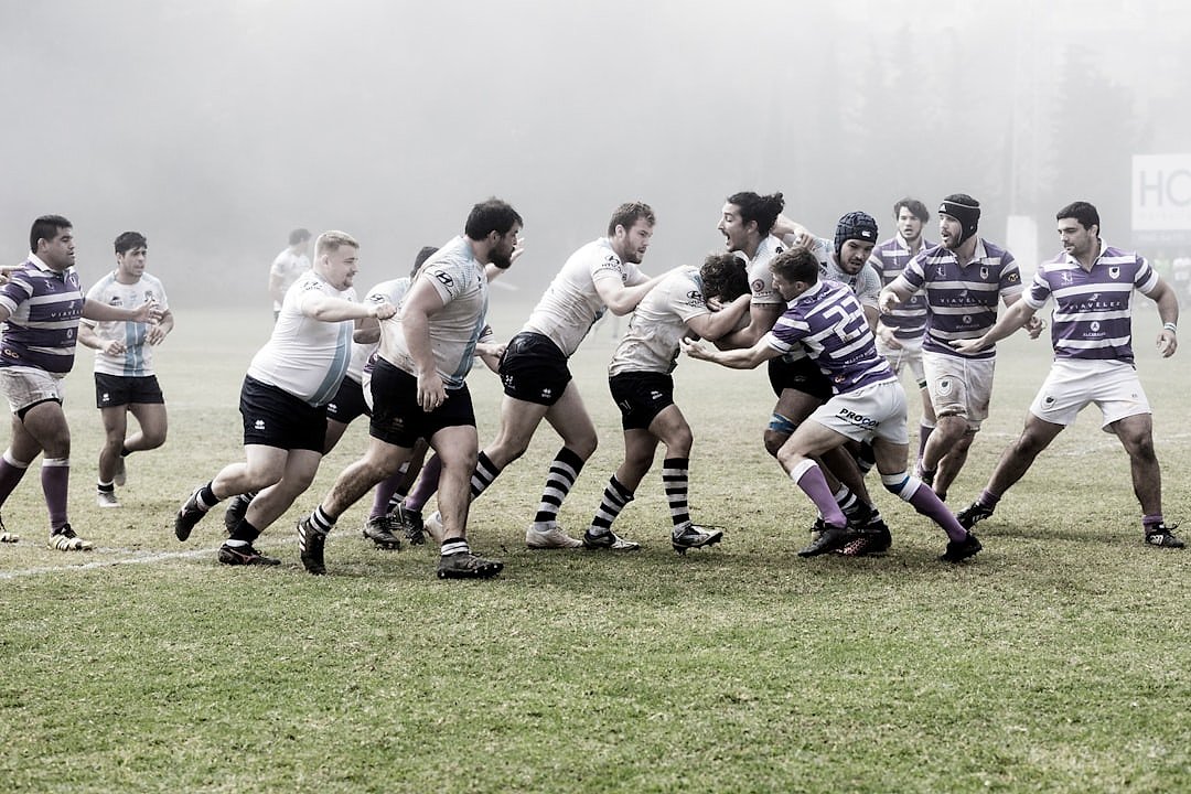 Rugby players contesting for the ball in a hard-fought match