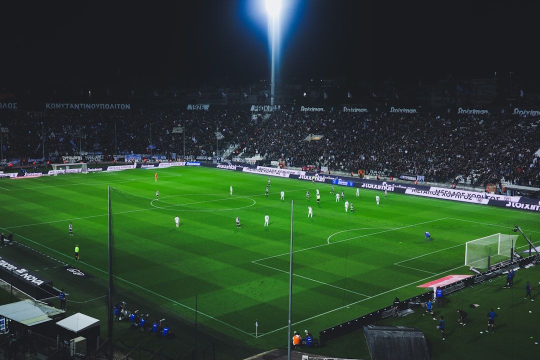 Football stadium illuminated at night during a Champions League match