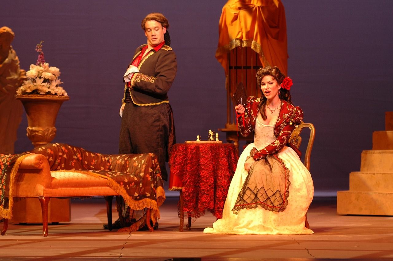Theatre stage with performers during a production, representing Avenue Q's award-winning Broadway run