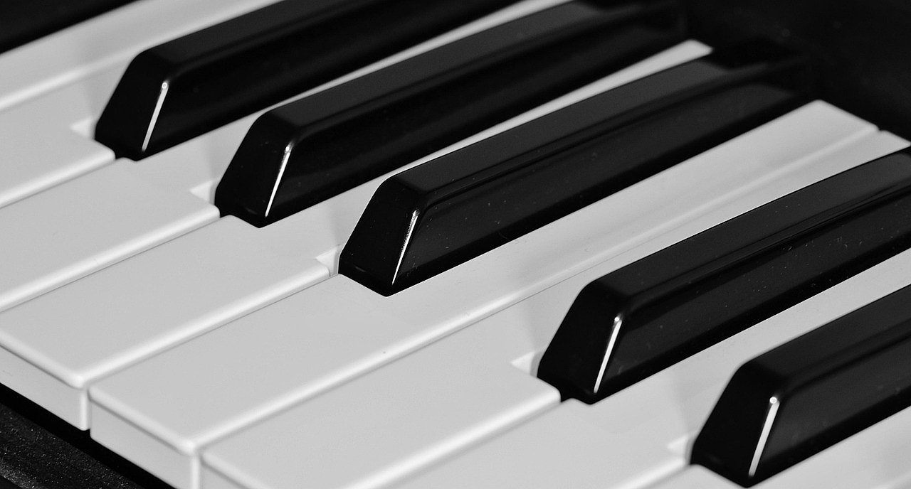 Close-up of piano keys, the instrument that defined Elton John's career from the very beginning