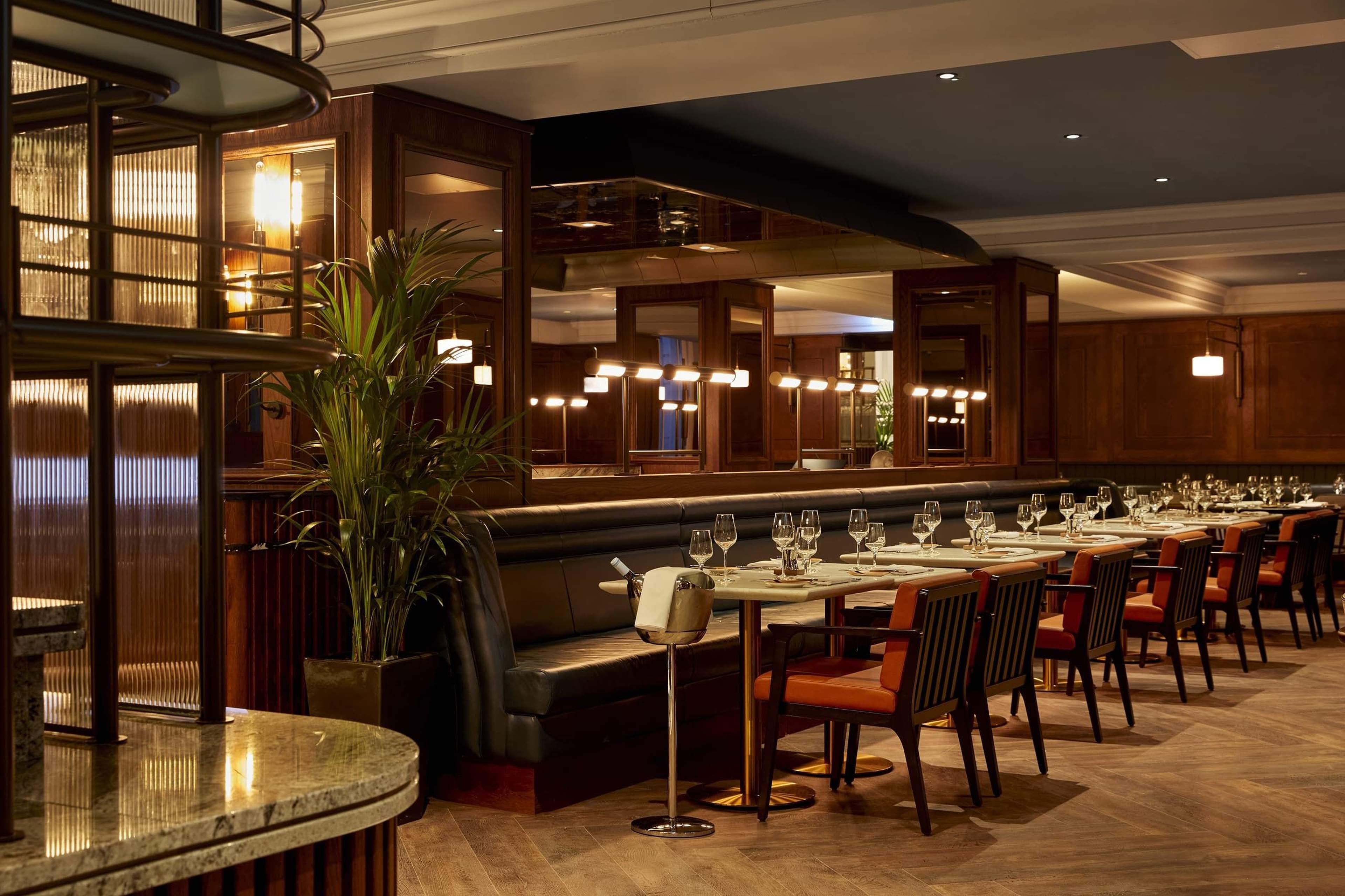 The Sorting Room at The Parkgate, a panelled dining room with leather banquettes and set tables