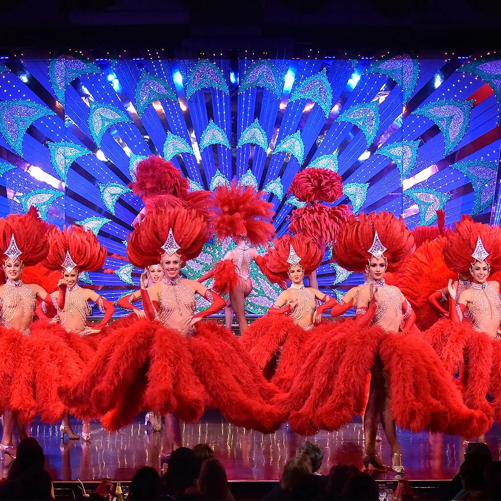 Cabaret showgirl in sequined costume performing on stage