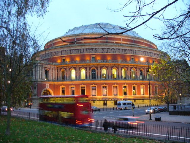 The Royal Albert Hall illuminated at dusk, ahead of an evening concert.