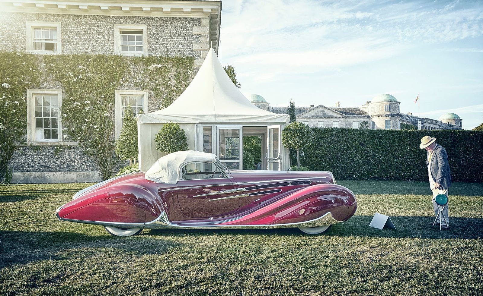 An Art Deco concours car on the Cartier lawn in front of Goodwood House