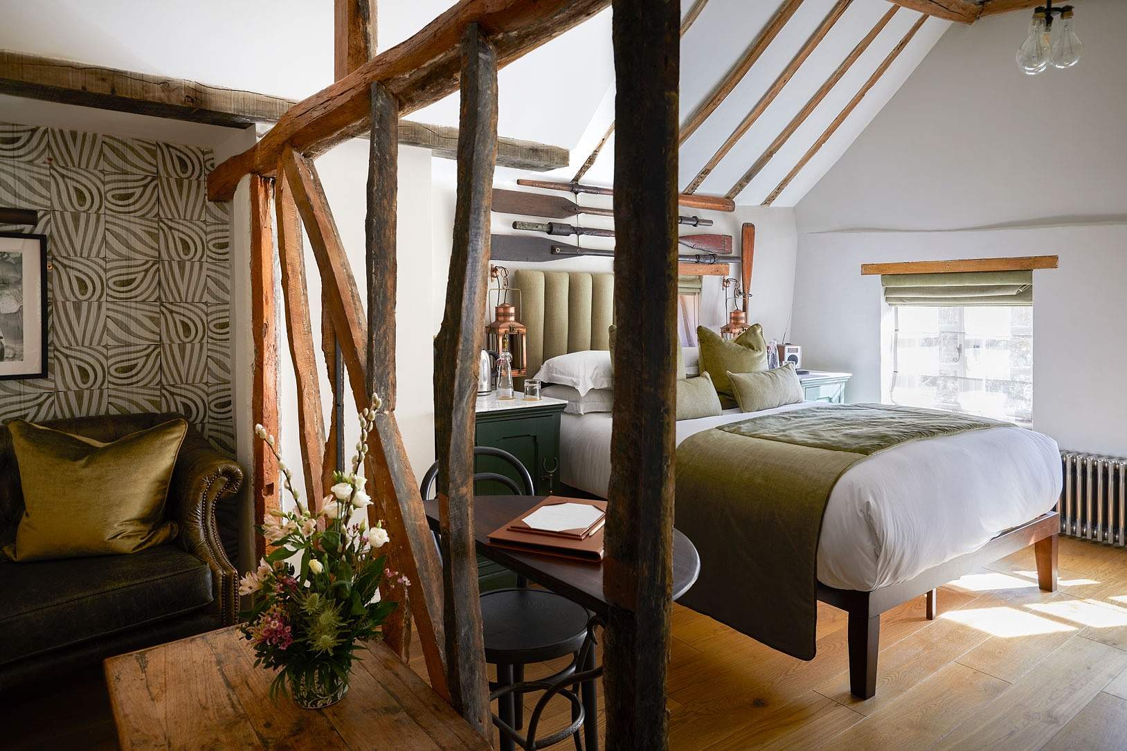 Beamed bedroom with a double bed at The Hand and Flowers