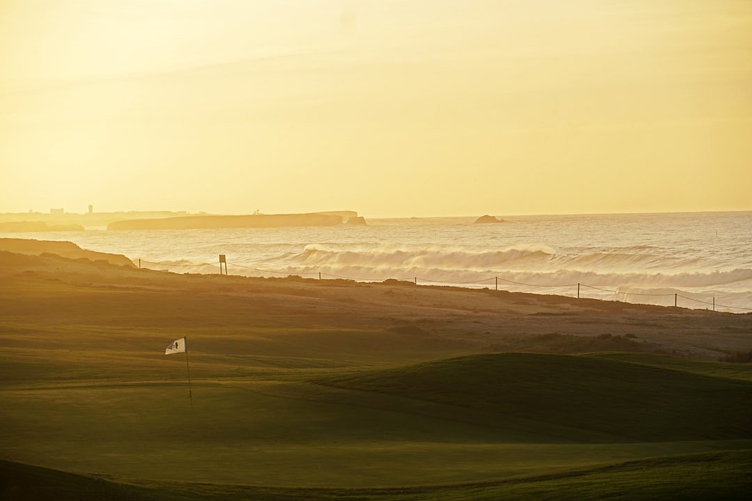 Links golf course at sunset, evoking the famous Duel in the Sun at Turnberry