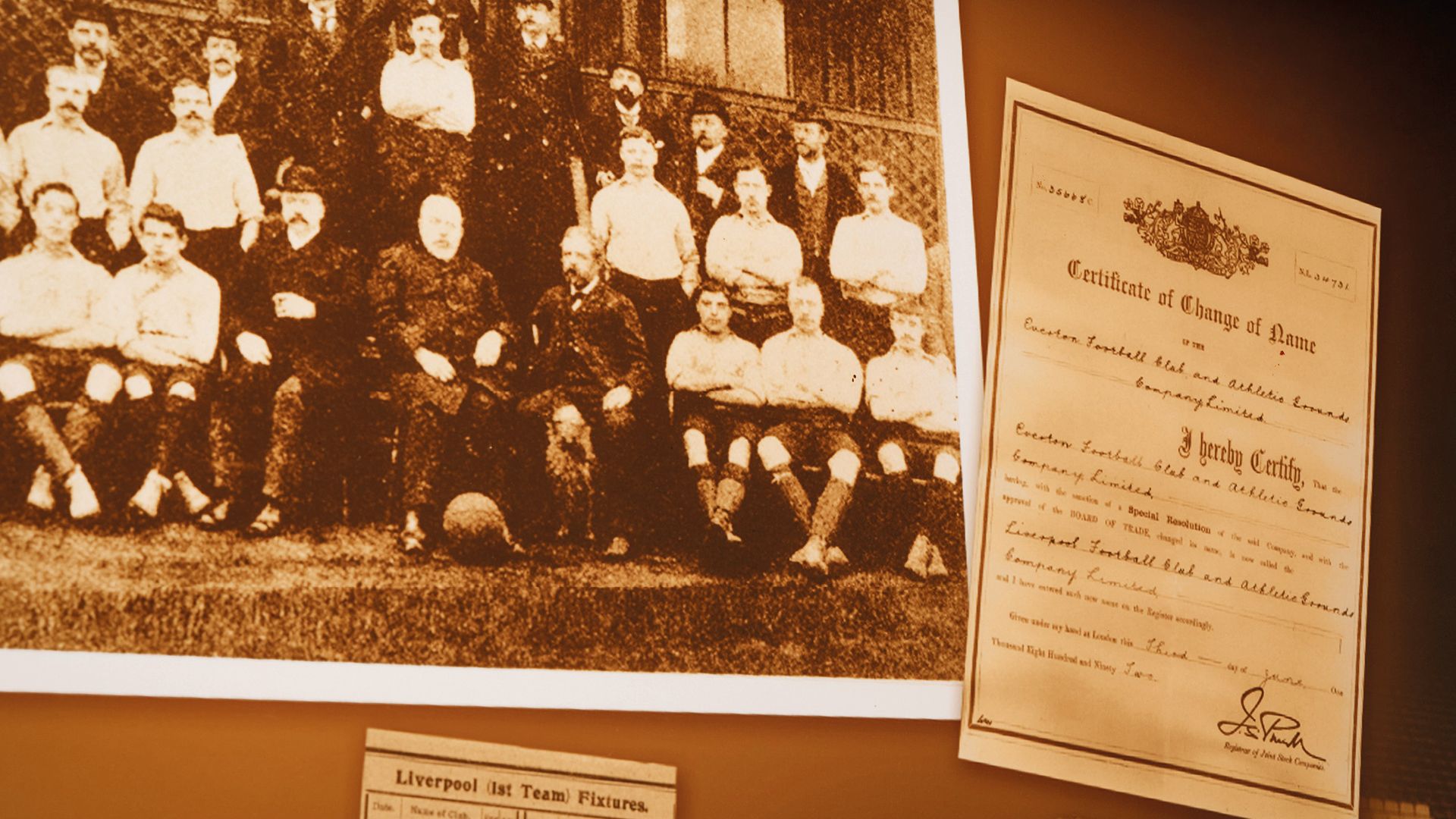 An early Liverpool team photograph and a framed club certificate on the wall at The Sandon