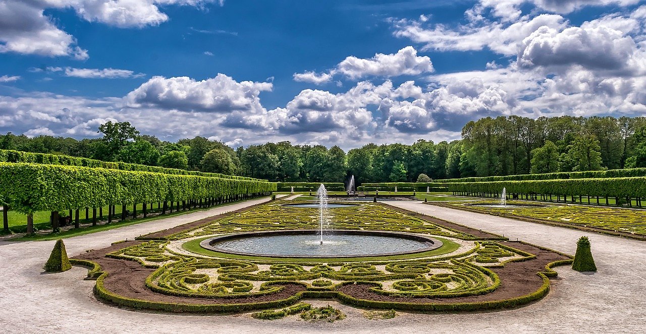 A formal garden design with fountain, reflecting the show garden tradition