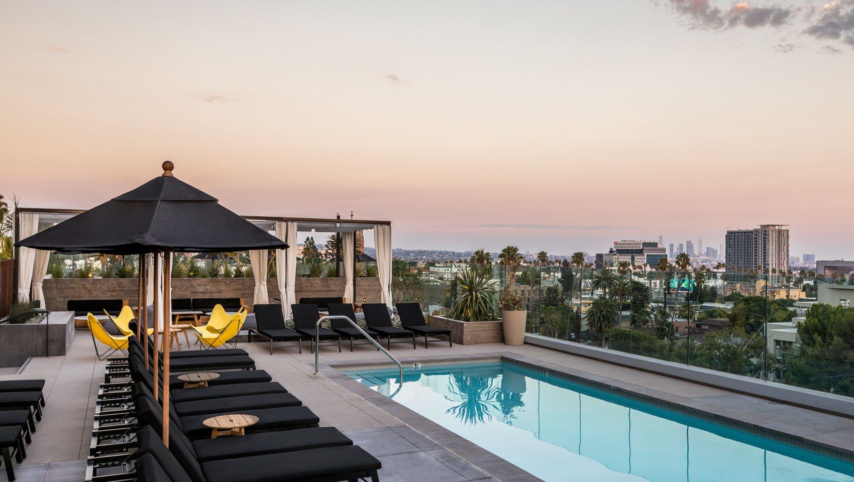 The rooftop pool at the Kimpton Everly at dusk, Hollywood beyond