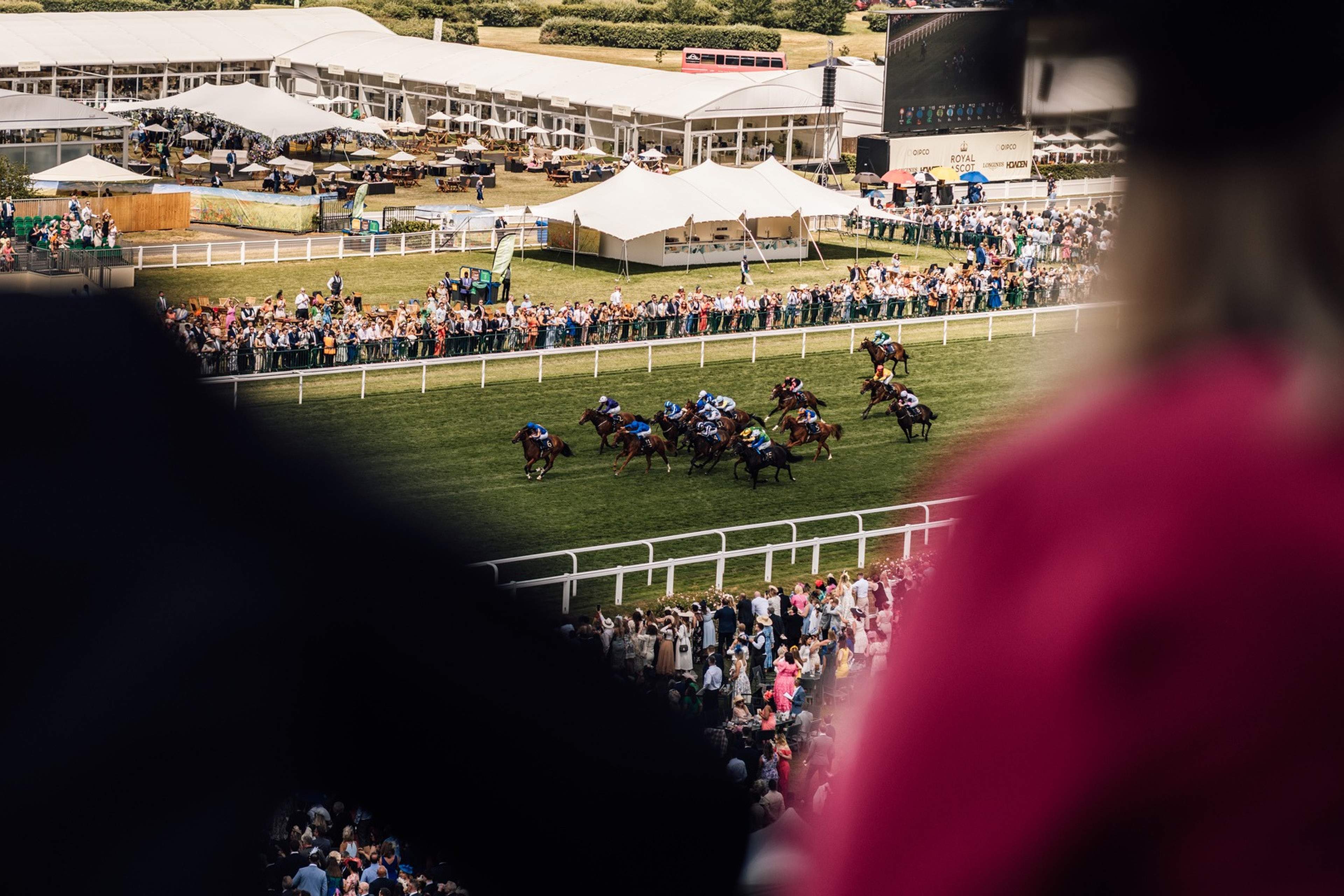Royal Ascot race in progress viewed across the home straight