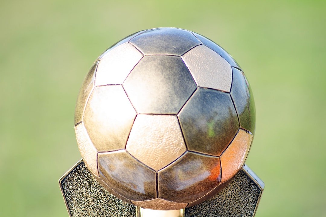 Football trophy on a wooden stand
