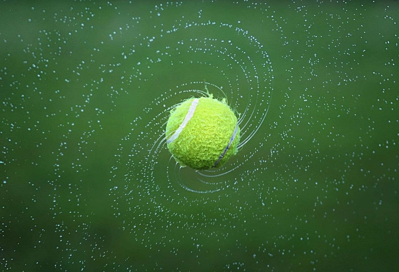 Tennis ball in dynamic motion, evoking the intensity of the 1980 Wimbledon final