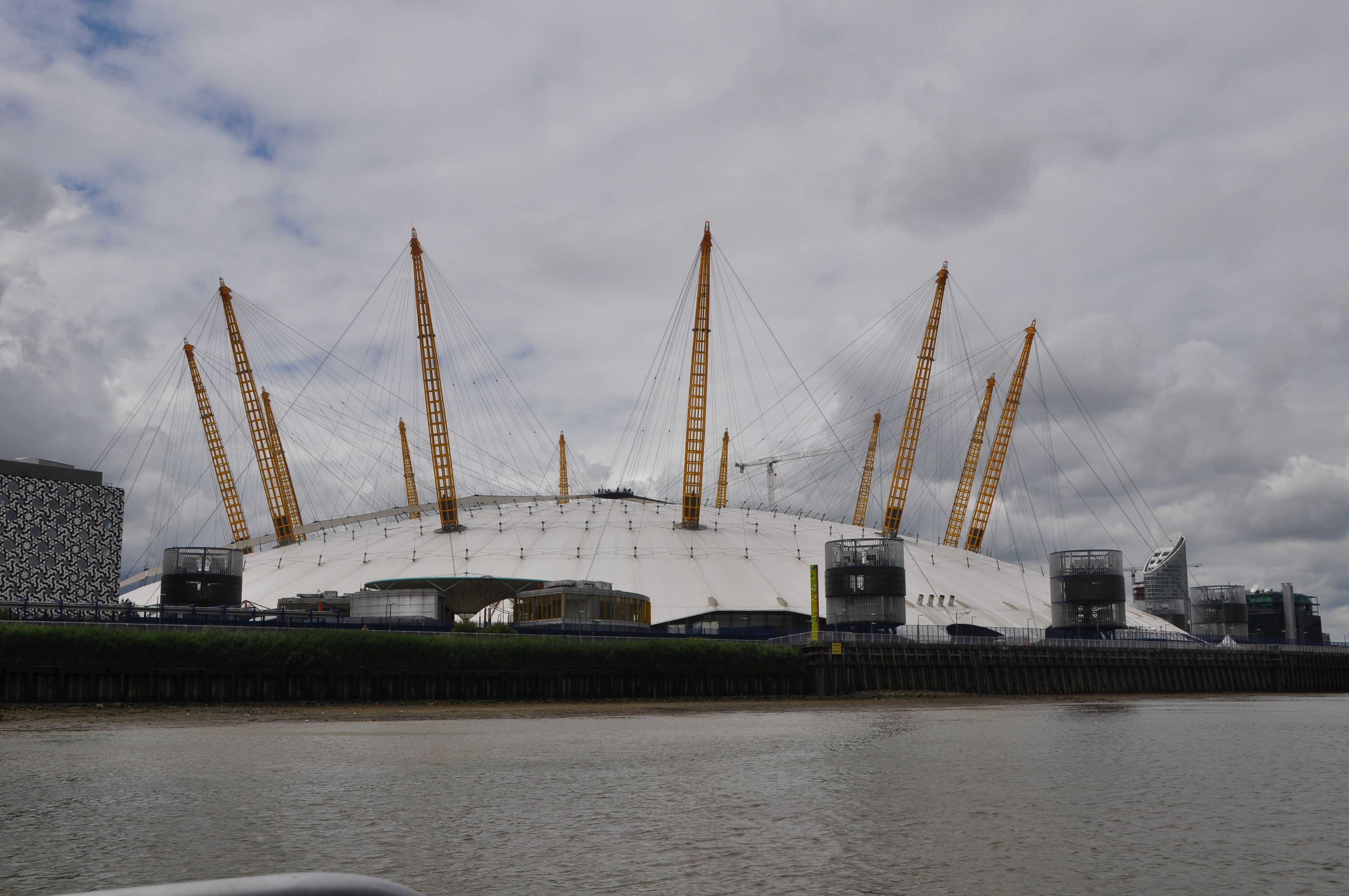 The white roof and yellow masts of The O2 on London’s Greenwich Peninsula