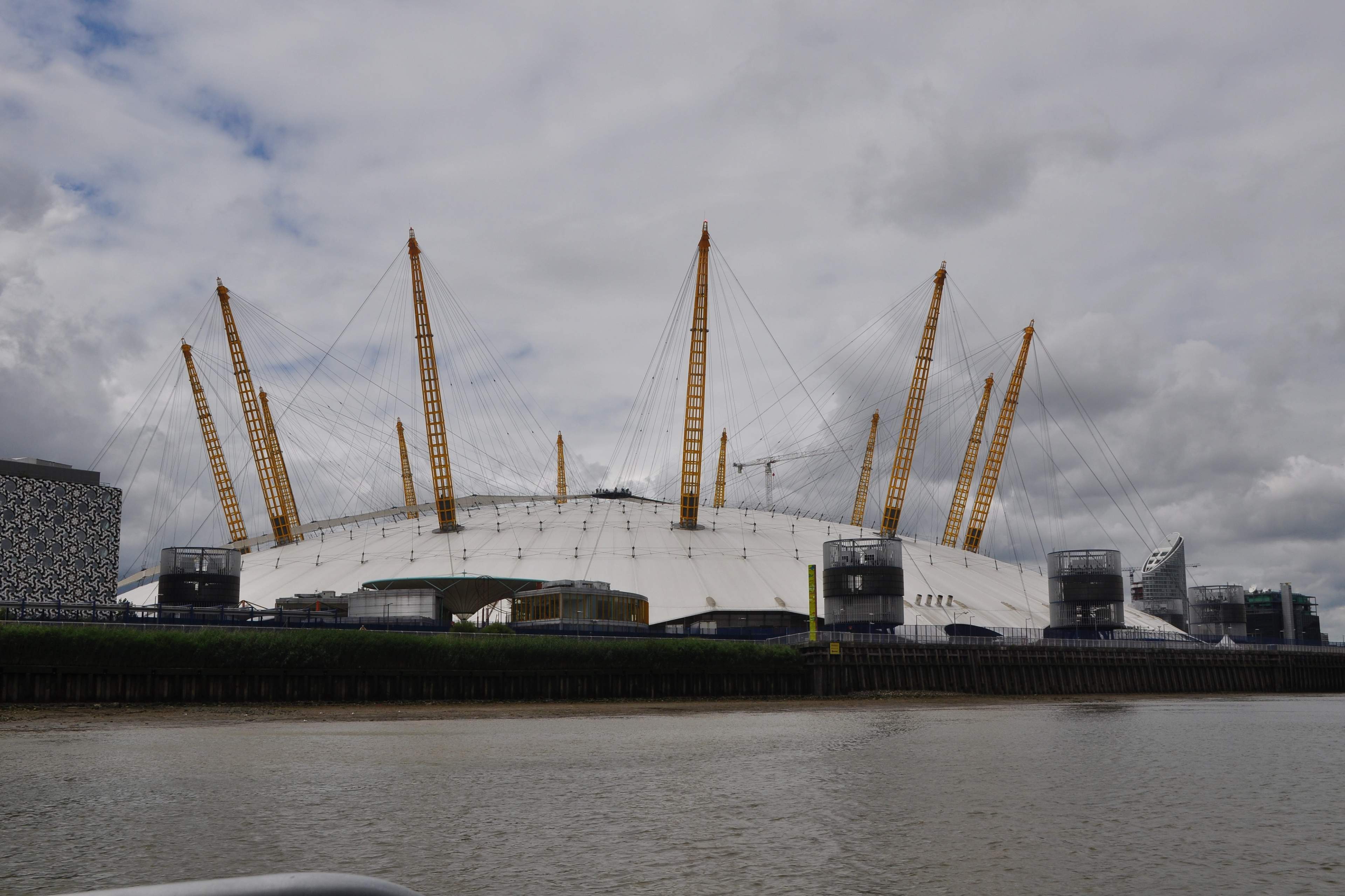 The white roof and yellow masts of The O2 on London’s Greenwich Peninsula
