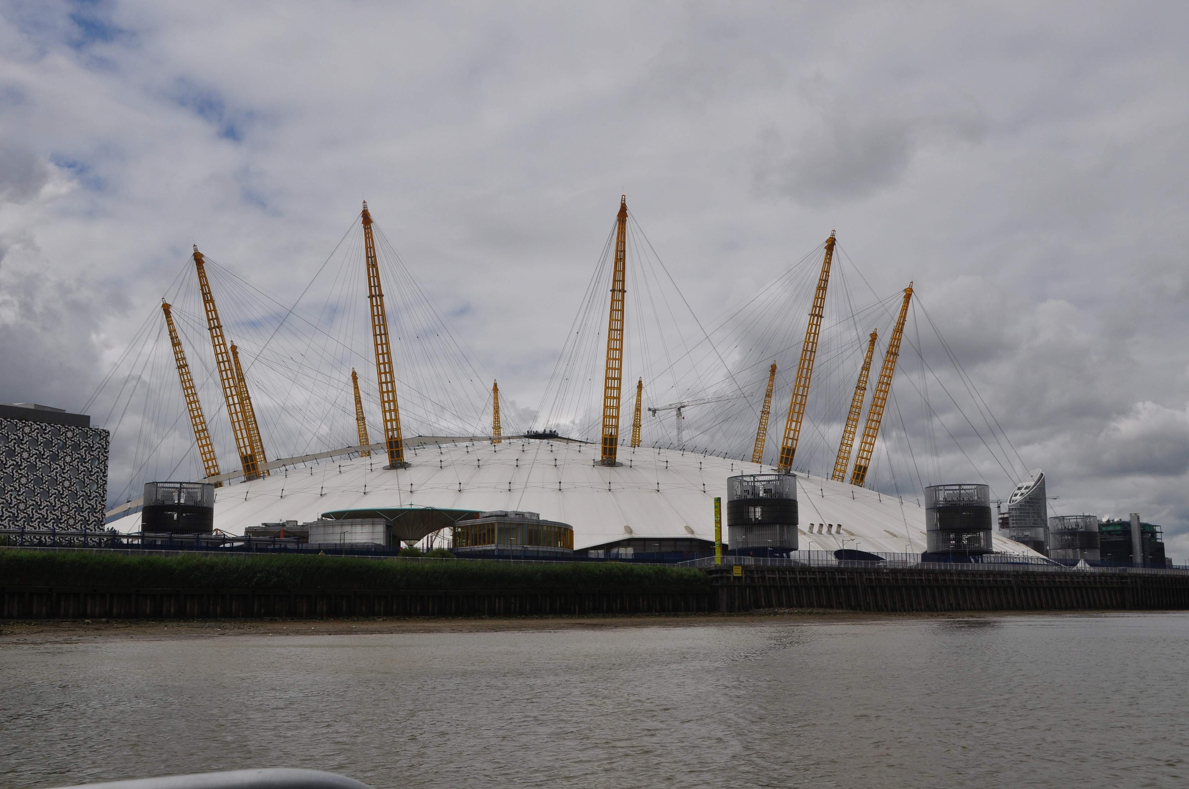 The white roof and yellow masts of The O2 on London’s Greenwich Peninsula